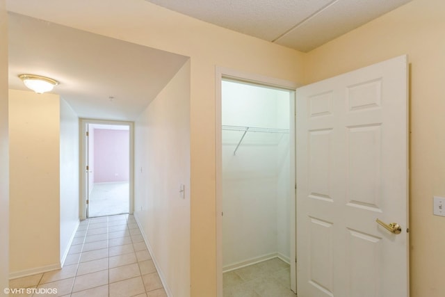 6807 N Milwaukee Ave Unit 303, Niles, IL 60714 - hallway with light tile patterned floors