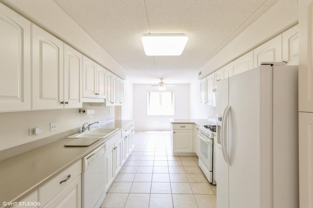 6807 N Milwaukee Ave Unit 303, Niles, IL 60714 - kitchen featuring white appliances, ceiling fan, light tile patterned floors, white cabinetry, and a textured ceiling