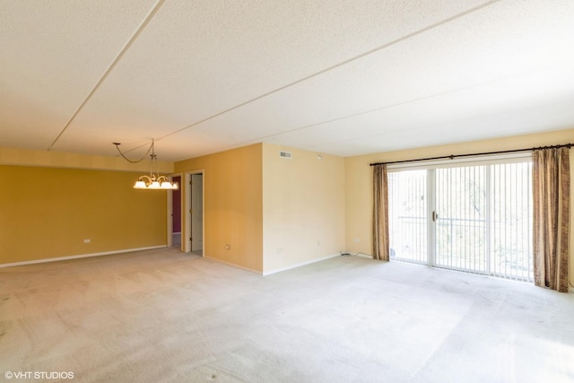 6807 N Milwaukee Ave Unit 303, Niles, IL 60714 - empty room featuring a chandelier and light colored carpet