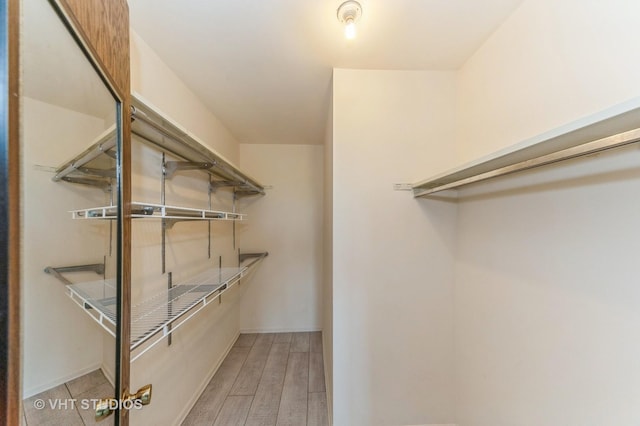 9500 N Washington St Unit 510, Niles, IL 60714 - walk in closet featuring light wood-type flooring