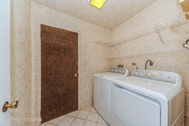 9500 N Washington St Unit 510, Niles, IL 60714 - washroom with independent washer and dryer, light tile patterned flooring, and wallpapered walls