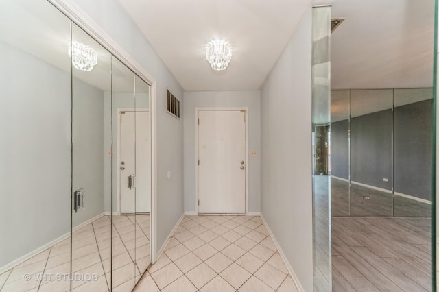 9500 N Washington St Unit 510, Niles, IL 60714 - hallway featuring baseboards and light tile patterned floors