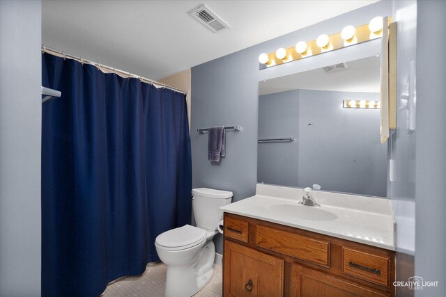 full bathroom with vanity, toilet, tile patterned floors, and a shower with curtain
