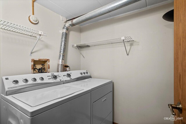 washroom featuring washer and dryer