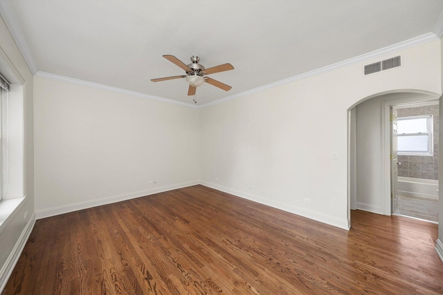 4860 W Warner Ave Unit 1, Chicago, IL 60641 - unfurnished room featuring arched walkways, ceiling fan, ornamental molding, dark wood finished floors, and baseboards
