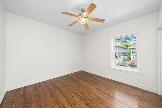 4860 W Warner Ave Unit 1, Chicago, IL 60641 - unfurnished room with dark wood-style floors, baseboards, and ceiling fan