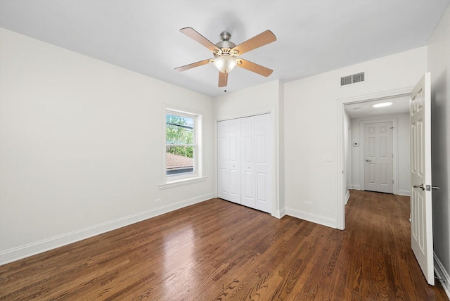 4860 W Warner Ave Unit 1, Chicago, IL 60641 - unfurnished bedroom featuring dark wood finished floors, a closet, baseboards, and a ceiling fan
