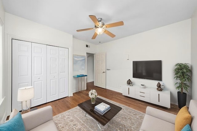 4860 W Warner Ave Unit 1, Chicago, IL 60641 - living area featuring a ceiling fan, wood finished floors, and baseboards