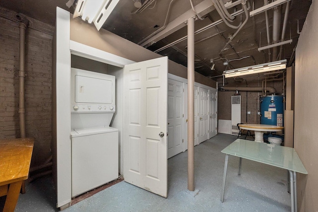 4860 W Warner Ave Unit 1, Chicago, IL 60641 - unfinished below grade area featuring stacked washer / drying machine and gas water heater