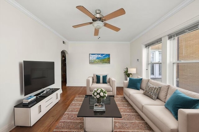 4860 W Warner Ave Unit 1, Chicago, IL 60641 - living room with arched walkways, ornamental molding, dark wood-style floors, ceiling fan, and baseboards