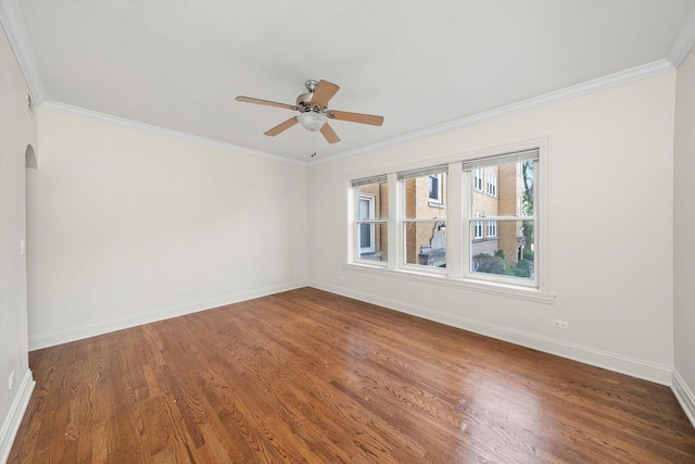 4860 W Warner Ave Unit 1, Chicago, IL 60641 - unfurnished room with baseboards, dark wood finished floors, ornamental molding, a ceiling fan, and arched walkways