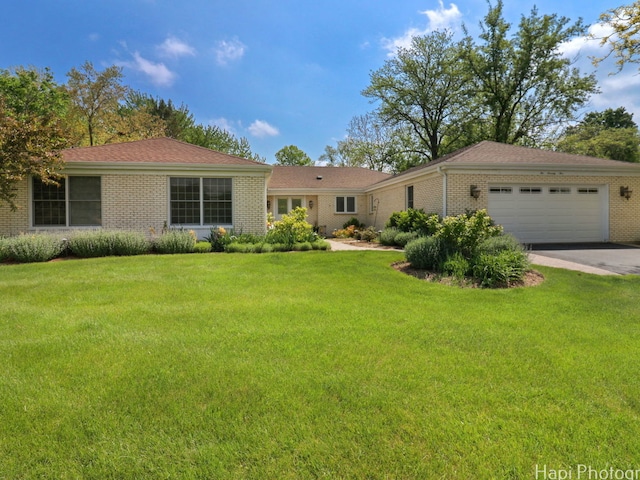275 Surrey Ln, Barrington, IL 60010 - ranch-style house with brick siding, an attached garage, a front lawn, and concrete driveway