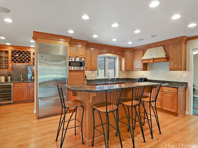275 Surrey Ln, Barrington, IL 60010 - kitchen featuring built in appliances, beverage cooler, custom range hood, light wood-type flooring, and recessed lighting