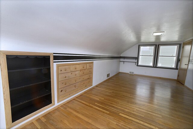 610 E Main St, Ottawa, IL 61350 - bonus room featuring wood finished floors, lofted ceiling, and beverage cooler