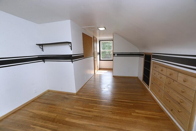 610 E Main St, Ottawa, IL 61350 - spacious closet with wood finished floors and lofted ceiling