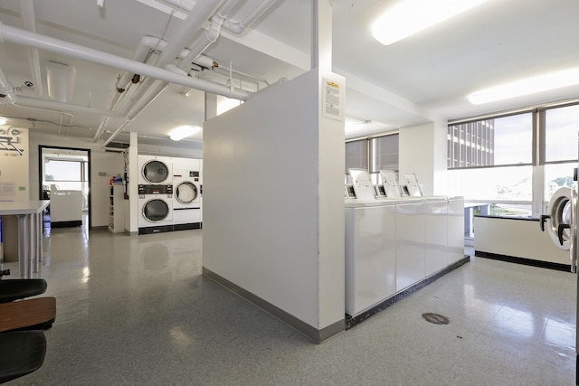 330 W Diversey Pkwy Unit 1209, Chicago, IL 60657 - hall featuring stacked washer / dryer, independent washer and dryer, baseboards, and tile patterned floors