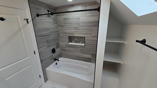 bathroom with a skylight, shower / bath combination, marble finish floors, and recessed lighting