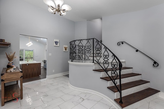 2531 E 1669th Rd, Ottawa, IL 61350 - stairway with a chandelier, marble finish flooring, and baseboards