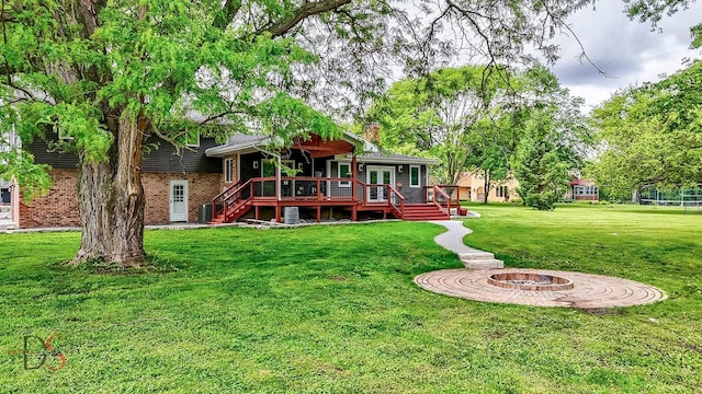 2531 E 1669th Rd, Ottawa, IL 61350 - back of house with a wooden deck, a chimney, a yard, and brick siding