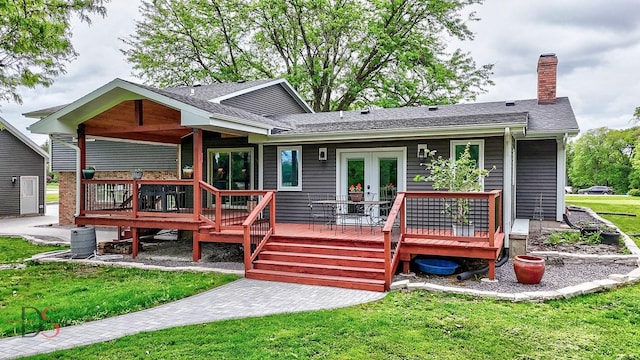 2531 E 1669th Rd, Ottawa, IL 61350 - back of property featuring a yard, a chimney, a deck, french doors, and roof with shingles