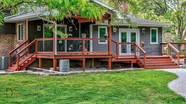 2531 E 1669th Rd, Ottawa, IL 61350 - back of property featuring a yard, a chimney, stairway, and central AC unit