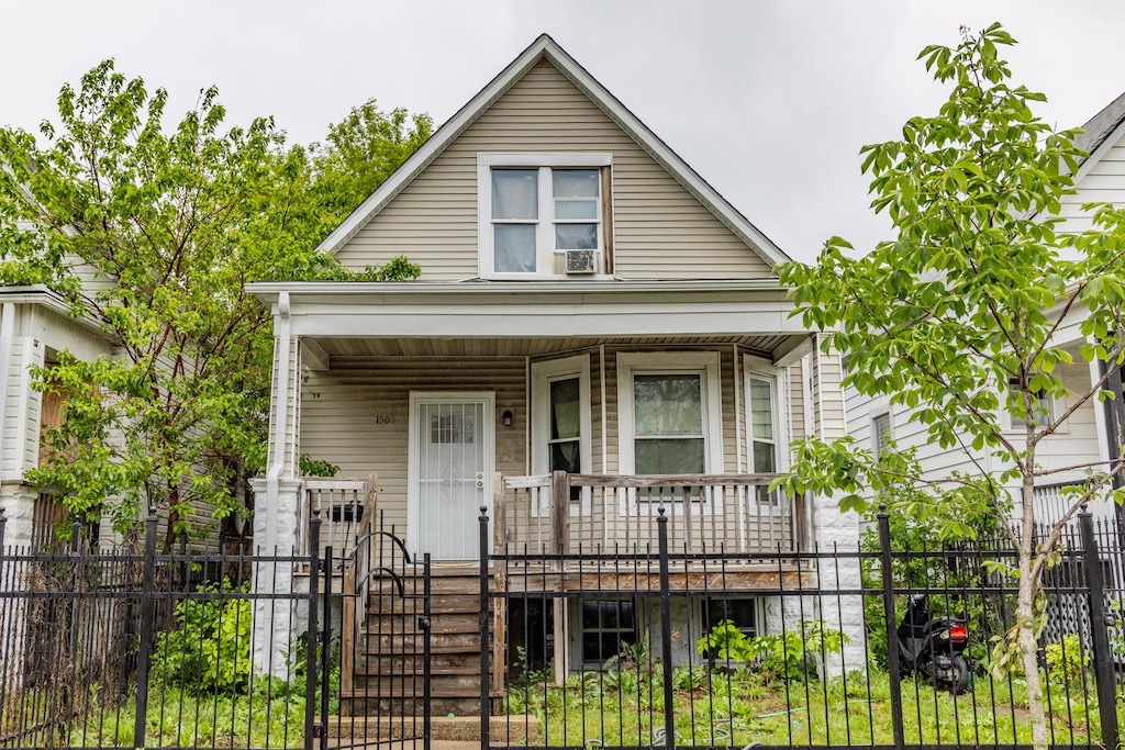 1508 W 72nd St, Chicago, IL 60636 - view of front facade featuring a porch, a fenced front yard, and a gate