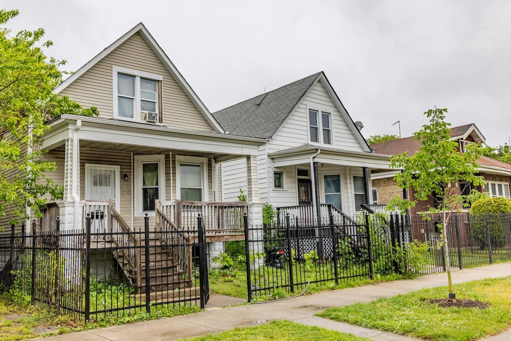 1508 W 72nd St, Chicago, IL 60636 - view of front of property featuring a porch, a fenced front yard, stairway, and a gate