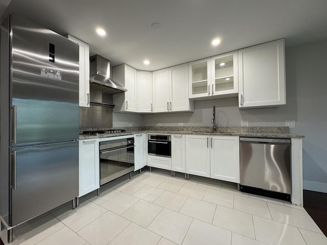 1021 Boxwood Ct Unit C1, Wheeling, IL 60090 - kitchen featuring stainless steel appliances, a sink, wall chimney exhaust hood, stone counters, and recessed lighting