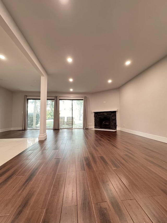 1021 Boxwood Ct Unit C1, Wheeling, IL 60090 - unfurnished living room featuring dark wood-type flooring, plenty of natural light, baseboards, and recessed lighting