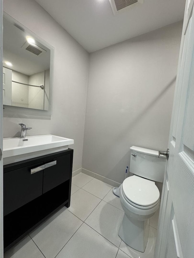 1021 Boxwood Ct Unit C1, Wheeling, IL 60090 - bathroom featuring vanity, toilet, tile patterned floors, and baseboards