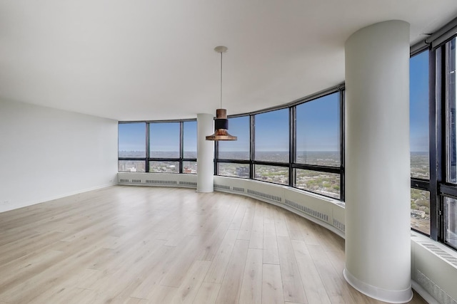5415 N Sheridan Rd Unit 4511, Chicago, IL 60640 - unfurnished living room featuring wood finished floors and floor to ceiling windows