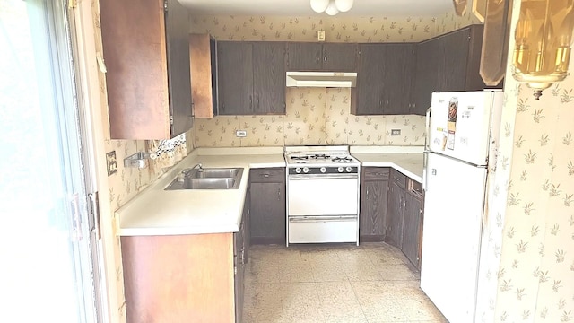 17710 Hillcrest Dr, Country Club Hills, IL 60478 - kitchen with white appliances, under cabinet range hood, a sink, wallpapered walls, and light flooring