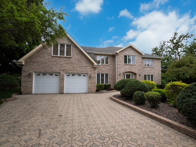1707 Frediani Ct, Mount Prospect, IL 60056 - view of front facade with decorative driveway, a garage, and brick siding