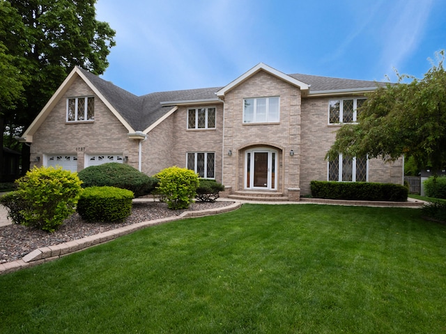 1707 Frediani Ct, Mount Prospect, IL 60056 - view of front facade featuring a front lawn, brick siding, a garage, and a shingled roof