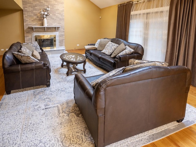 1707 Frediani Ct, Mount Prospect, IL 60056 - living area with wood finished floors, vaulted ceiling, and a brick fireplace