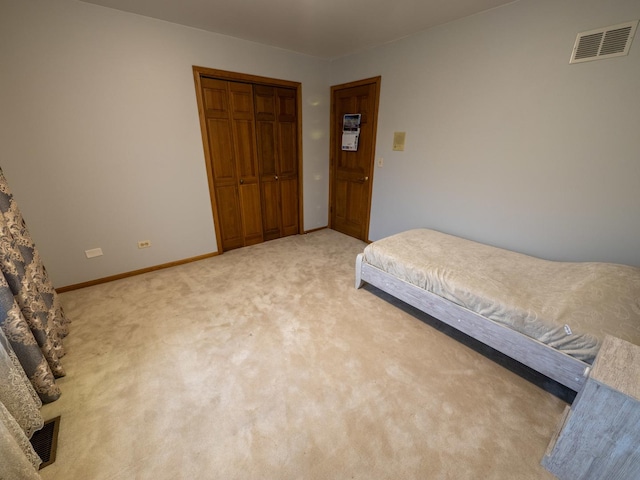 1707 Frediani Ct, Mount Prospect, IL 60056 - bedroom with light carpet, a closet, and baseboards