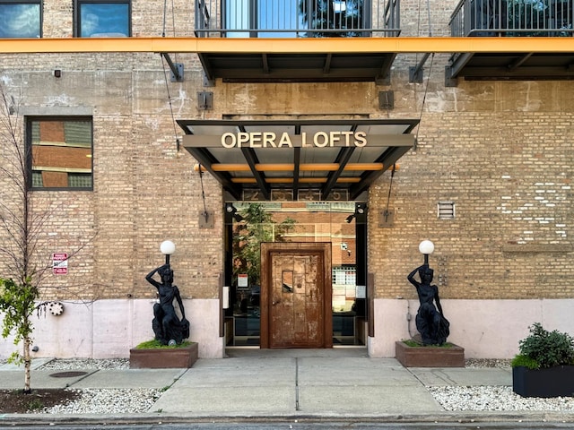 2545 S Dearborn St Unit 405, Chicago, IL 60616 - doorway to property featuring brick siding and a gate