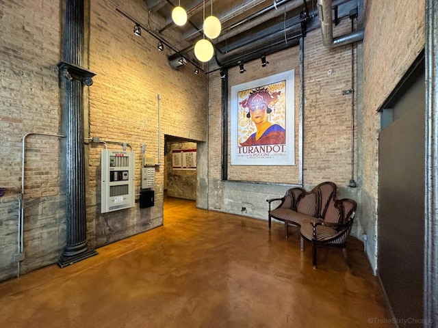 2545 S Dearborn St Unit 405, Chicago, IL 60616 - common area featuring a high ceiling and brick wall