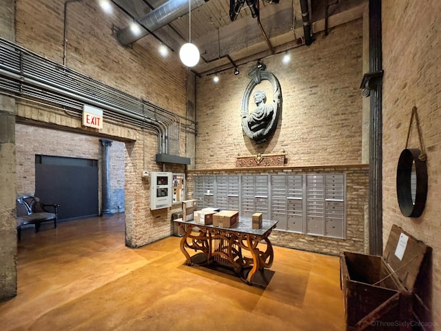 2545 S Dearborn St Unit 405, Chicago, IL 60616 - building lobby featuring a towering ceiling and brick wall