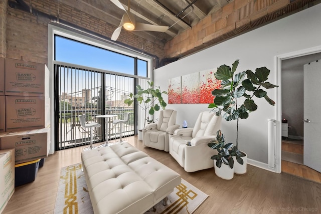 2545 S Dearborn St Unit 405, Chicago, IL 60616 - living room featuring a towering ceiling and wood finished floors