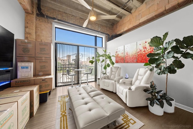 2545 S Dearborn St Unit 405, Chicago, IL 60616 - living room with a towering ceiling and wood finished floors