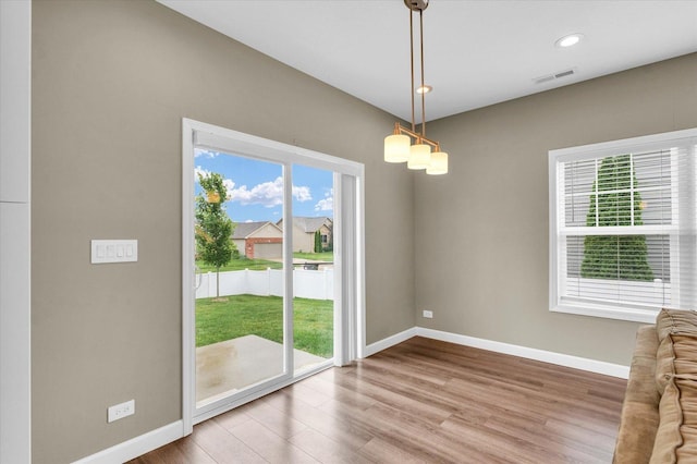 3311 Memory Ln E, Unit East, Urbana, IL 61802 - unfurnished dining area with wood finished floors, baseboards, and recessed lighting