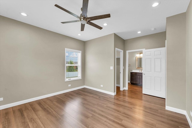 3311 Memory Ln E, Unit East, Urbana, IL 61802 - unfurnished bedroom with wood finished floors, baseboards, recessed lighting, ceiling fan, and ensuite bathroom