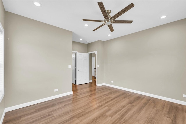 3311 Memory Ln E, Unit East, Urbana, IL 61802 - spare room with light wood-style flooring, a ceiling fan, baseboards, and recessed lighting