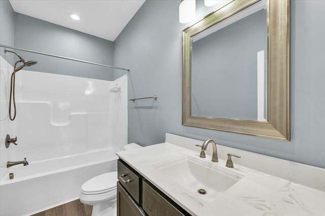 3311 Memory Ln E, Unit East, Urbana, IL 61802 - bathroom with toilet, vanity, shower / bathtub combination, and wood finished floors