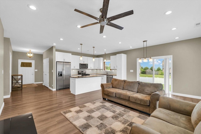 3311 Memory Ln E, Unit East, Urbana, IL 61802 - living area with a ceiling fan, wood finished floors, baseboards, and recessed lighting