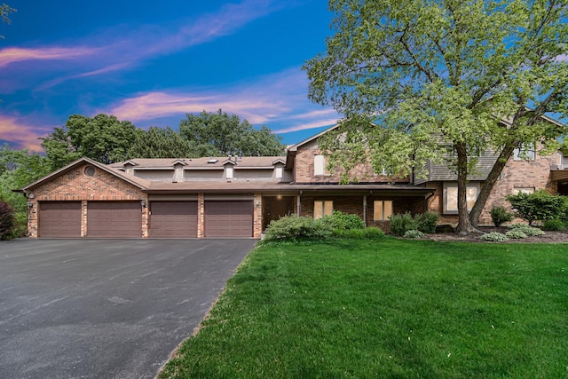 986 W Ct Unit C, Naperville, IL 60563 - view of front of house with brick siding, an attached garage, a front yard, and driveway