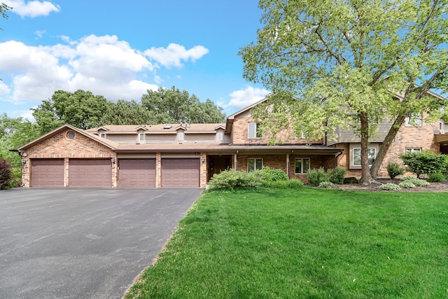 986 W Ct Unit C, Naperville, IL 60563 - view of front of house with a garage, a front lawn, brick siding, and driveway