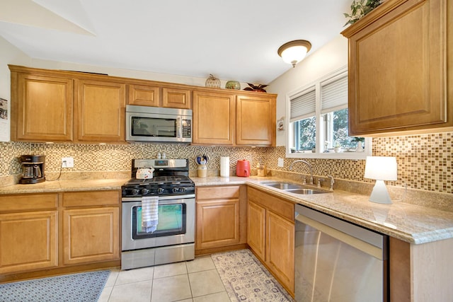 986 W Ct Unit C, Naperville, IL 60563 - kitchen featuring appliances with stainless steel finishes, a sink, backsplash, and light tile patterned flooring