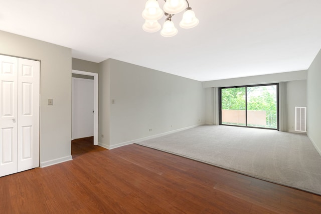 3350 N Carriageway Dr Unit 208, Arlington Heights, IL 60004 - unfurnished living room with a chandelier, baseboards, and wood finished floors